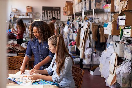 female native american clothing - Woman stands to train an apprentice at clothes design studio Foto de stock - Super Valor sin royalties y Suscripción, Código: 400-08839026