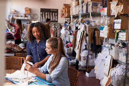 female native american clothing - Woman training apprentice at clothes manufacturing workshop Photographie de stock - Aubaine LD & Abonnement, Code: 400-08839027