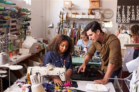 Colleagues in discussion at a clothes manufacturing studio Stock Photo - Budget Royalty-Free & Subscription, Code: 400-08839038