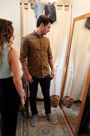 simsearch:649-07064921,k - Partner and man trying on clothes in changing room, vertical Photographie de stock - Aubaine LD & Abonnement, Code: 400-08839078