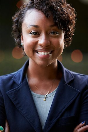 Outdoors Head And Shoulders Portrait Of Smiling Young Woman Stock Photo - Budget Royalty-Free & Subscription, Code: 400-08839105