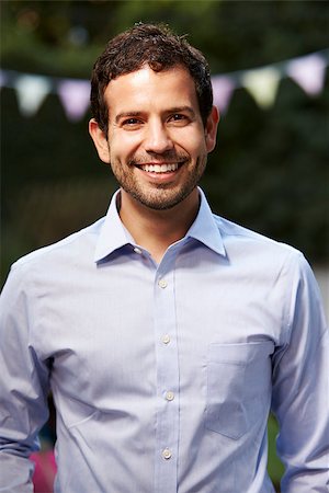 Outdoors Head And Shoulders Portrait Of Smiling Young Man Stock Photo - Budget Royalty-Free & Subscription, Code: 400-08839107