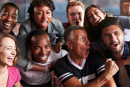 Portrait Of Friends Watching Game In Sports Bar On Screens Stock Photo - Budget Royalty-Free & Subscription, Code: 400-08839141