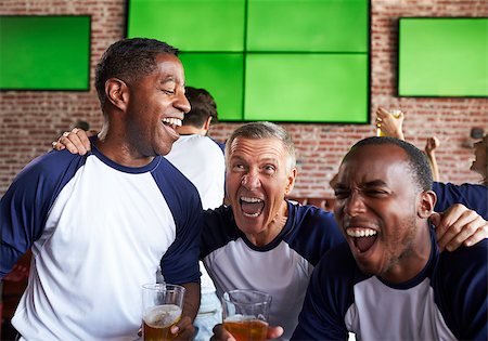 friends smiling 30 beer - Male Friends Watching Game In Sports Bar Celebrating Stock Photo - Budget Royalty-Free & Subscription, Code: 400-08839159