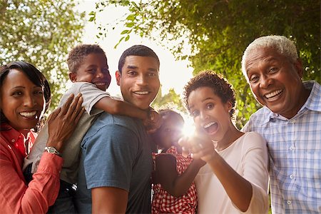 Multi generation black family in garden look to camera Photographie de stock - Aubaine LD & Abonnement, Code: 400-08839237