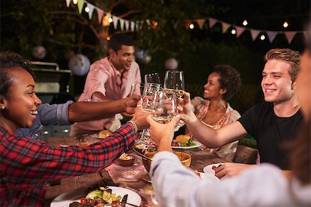 Friends and family toasting at garden dinner party, close up Stock Photo - Budget Royalty-Free & Subscription, Code: 400-08839266