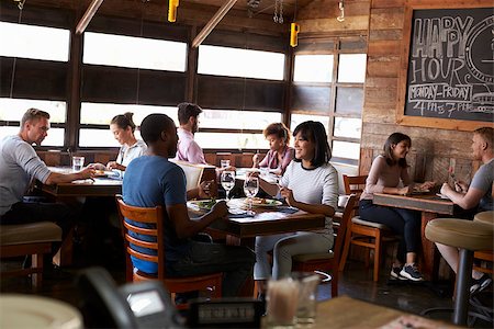 restaurant interior chalkboard - Couples enjoying lunch in a busy restaurant Stock Photo - Budget Royalty-Free & Subscription, Code: 400-08839275