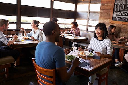 restaurant interior chalkboard - Mixed race couple enjoying lunch in a busy restaurant Stock Photo - Budget Royalty-Free & Subscription, Code: 400-08839276