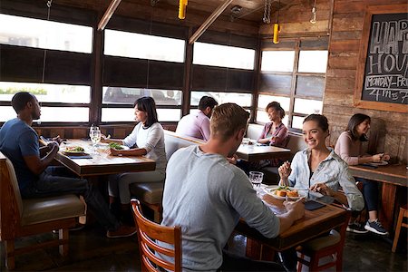 restaurant interior chalkboard - Young couples eating lunch relax in a restaurant Stock Photo - Budget Royalty-Free & Subscription, Code: 400-08839272
