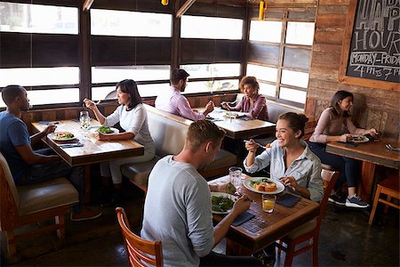 restaurant interior chalkboard - Couples relaxing over lunch in a restaurant, elevated view Stock Photo - Budget Royalty-Free & Subscription, Code: 400-08839273
