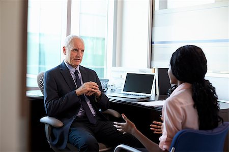 Doctor In Consultation With Female Patient In Office Stock Photo - Budget Royalty-Free & Subscription, Code: 400-08839360