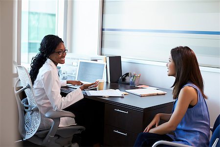 simsearch:400-04021788,k - Doctor Wearing White Coat Meeting With Female Patient Stock Photo - Budget Royalty-Free & Subscription, Code: 400-08839386