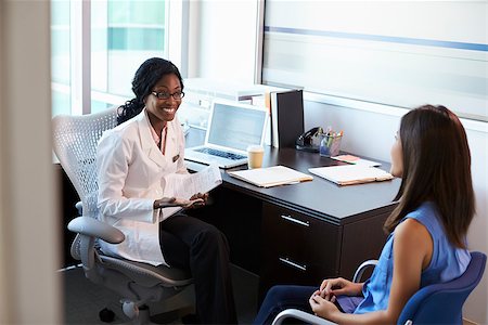 simsearch:400-04021788,k - Doctor Wearing White Coat Meeting With Female Patient Stock Photo - Budget Royalty-Free & Subscription, Code: 400-08839387