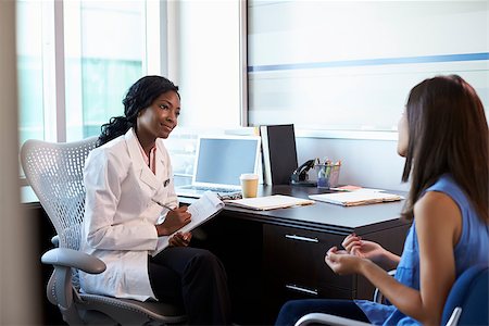Doctor Wearing White Coat Meeting With Female Patient Stock Photo - Budget Royalty-Free & Subscription, Code: 400-08839388