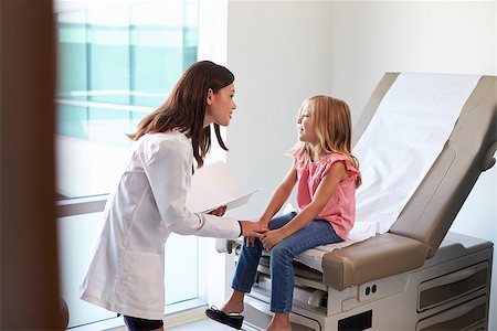 simsearch:400-04021788,k - Pediatrician In White Coat With Child In Exam Room Stock Photo - Budget Royalty-Free & Subscription, Code: 400-08839476