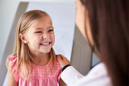 Pediatrician In White Coat With Child In Exam Room Stock Photo - Budget Royalty-Free & Subscription, Code: 400-08839477