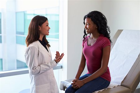 simsearch:400-04021788,k - Female Doctor Meeting With Patient In Exam Room Stock Photo - Budget Royalty-Free & Subscription, Code: 400-08839470