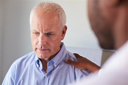 Doctor Talking To Unhappy Male Patient In Exam Room Stock Photo - Budget Royalty-Free & Subscription, Code: 400-08839485