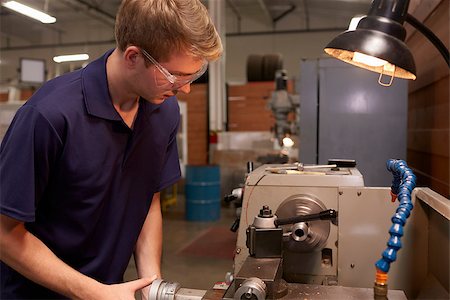 Male Engineer In Factory Using Milling Machine Stock Photo - Budget Royalty-Free & Subscription, Code: 400-08839537