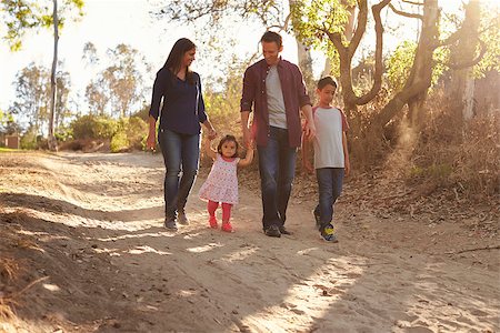 Mixed race family walking on rural path, front view Stock Photo - Budget Royalty-Free & Subscription, Code: 400-08839684