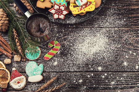 snowflake cookie - Gingerbreads and coffee for new years and christmas on wooden background, xmas theme Stock Photo - Budget Royalty-Free & Subscription, Code: 400-08831329