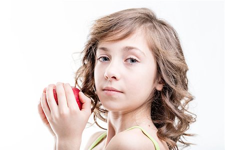 simsearch:400-08831347,k - portrait on white of a girl holding a red apple she's about to bite and eat Stock Photo - Budget Royalty-Free & Subscription, Code: 400-08831343
