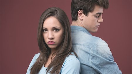 Young sad couple arguing and standing back to back Stock Photo - Budget Royalty-Free & Subscription, Code: 400-08832184