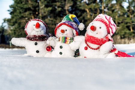 funny freezing cold photos - Happy snowman family with hats n the snow Stock Photo - Budget Royalty-Free & Subscription, Code: 400-08832455