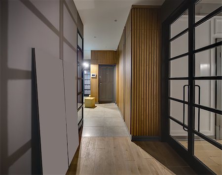 Hallway in a modern style with glowing lamps and gray walls. On the floor there are tiles and a parquet. There is a large wooden wardrobe, gray door, yellow pouf and glass black doors. Vertical. Stock Photo - Budget Royalty-Free & Subscription, Code: 400-08832536