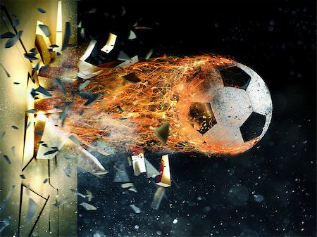Professional soccer fireball leaves trails of flames breaks through a wall Stock Photo - Budget Royalty-Free & Subscription, Code: 400-08832965