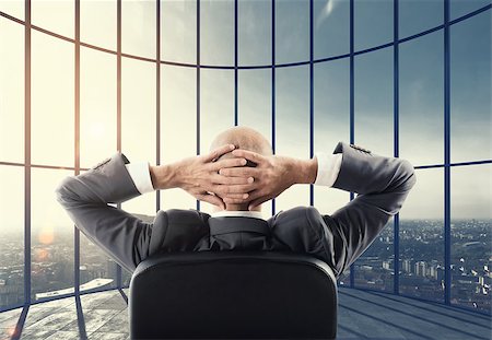 simsearch:400-08812456,k - Businessman enjoys his professional success and watches the view over the city. Mixed media Stock Photo - Budget Royalty-Free & Subscription, Code: 400-08832969
