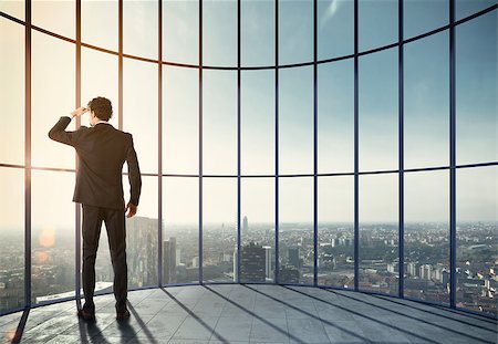 simsearch:400-08812456,k - Businessman enjoys his professional success and watches the view over the city. Mixed media Stock Photo - Budget Royalty-Free & Subscription, Code: 400-08832974