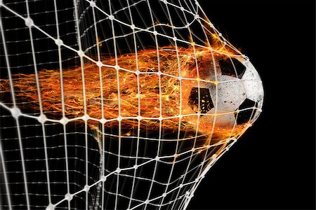 soccer dynamic - Professional soccer fireball leaves trails of flames and scores a goal on the net Stock Photo - Budget Royalty-Free & Subscription, Code: 400-08833140