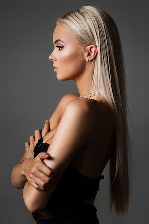 hairstyle, haircare and fashion concept - natural blond woman profile portrait with beautiful hair on grey background Stock Photo - Budget Royalty-Free & Subscription, Code: 400-08833365