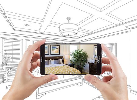 Hands Holding Smart Phone Displaying Photo of Custom Bedroom Drawing Behind. Stock Photo - Budget Royalty-Free & Subscription, Code: 400-08864214