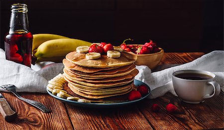 Homemade Pancakes with Fruits, Maple Syrup and Cup of Tea. Stock Photo - Budget Royalty-Free & Subscription, Code: 400-08864844