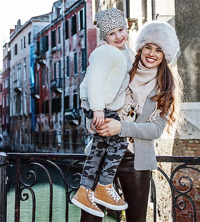 simsearch:400-07954337,k - Venice. Off the Beaten Path. smiling trendy mother and daughter travellers in Venice, Italy in the winter Stock Photo - Budget Royalty-Free & Subscription, Code: 400-08864984