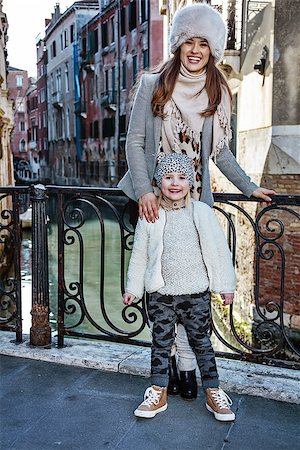 simsearch:400-07954337,k - Venice. Off the Beaten Path. Full length portrait of smiling trendy mother and daughter tourists in Venice, Italy in the winter Stock Photo - Budget Royalty-Free & Subscription, Code: 400-08864980