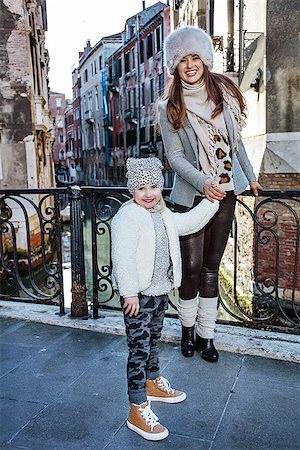simsearch:400-08134697,k - Venice. Off the Beaten Path. Full length portrait of happy trendy mother and daughter tourists in Venice, Italy in the winter having walking tour Stock Photo - Budget Royalty-Free & Subscription, Code: 400-08864981