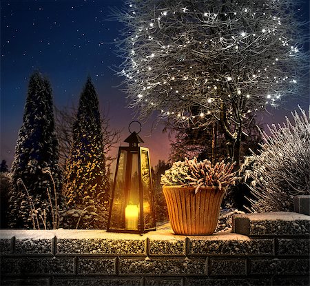 Christmas lantern on snowy stone wall in winter garden Stock Photo - Budget Royalty-Free & Subscription, Code: 400-08861255