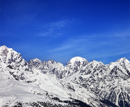 simsearch:400-08671175,k - Snow mountains and blue sky in winter at sun day. Caucasus Mountains. Svaneti region of Georgia. Stock Photo - Budget Royalty-Free & Subscription, Code: 400-08861583