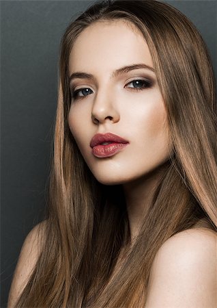 simsearch:400-06179308,k - Beautiful woman model portrait with long hair on dark background. Red lips Stock Photo - Budget Royalty-Free & Subscription, Code: 400-08861664