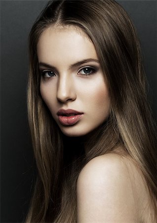 Beautiful woman model portrait with long hair on black background. Red lips Stock Photo - Budget Royalty-Free & Subscription, Code: 400-08861666