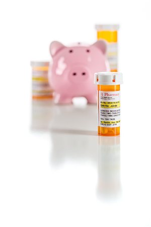 simsearch:400-08862116,k - Piggy Bank and Non-Proprietary Medicine Prescription Bottles Isolated on a White Background. Stock Photo - Budget Royalty-Free & Subscription, Code: 400-08862126