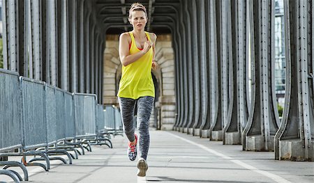 fitness female france outdoor - Outdoors fitness in Paris. Full length portrait of young active woman jogging on Pont de Bir-Hakeim bridge in Paris Stock Photo - Budget Royalty-Free & Subscription, Code: 400-08862691