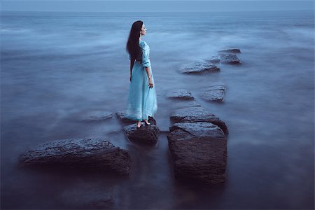 fotolit (artist) - Beautiful young woman on sea in twilight. Long time exposure Foto de stock - Royalty-Free Super Valor e Assinatura, Número: 400-08862790