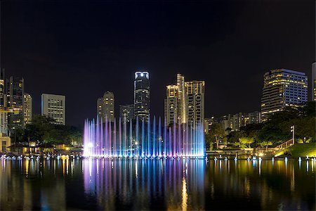 simsearch:400-08114490,k - Kuala Lumpur Malaysia City Skyline from KLCC Park by Symphony Lake water fountain light show at night Foto de stock - Super Valor sin royalties y Suscripción, Código: 400-08862861