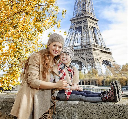 simsearch:400-09031587,k - Autumn getaways in Paris with family. Portrait of smiling mother and daughter travellers on embankment near Eiffel tower in Paris, France sitting on the parapet Stock Photo - Budget Royalty-Free & Subscription, Code: 400-08863318