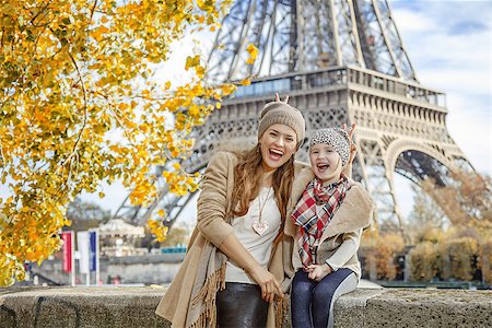 simsearch:400-09031587,k - Autumn getaways in Paris with family. Portrait of happy mother and child travellers on embankment in Paris, France having fun time Stock Photo - Budget Royalty-Free & Subscription, Code: 400-08863310