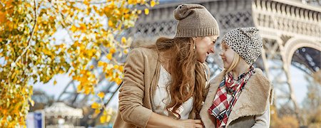 simsearch:400-09031587,k - Autumn getaways in Paris with family. Portrait of smiling mother and child travellers on embankment near Eiffel tower in Paris, France having fun time Stock Photo - Budget Royalty-Free & Subscription, Code: 400-08863312